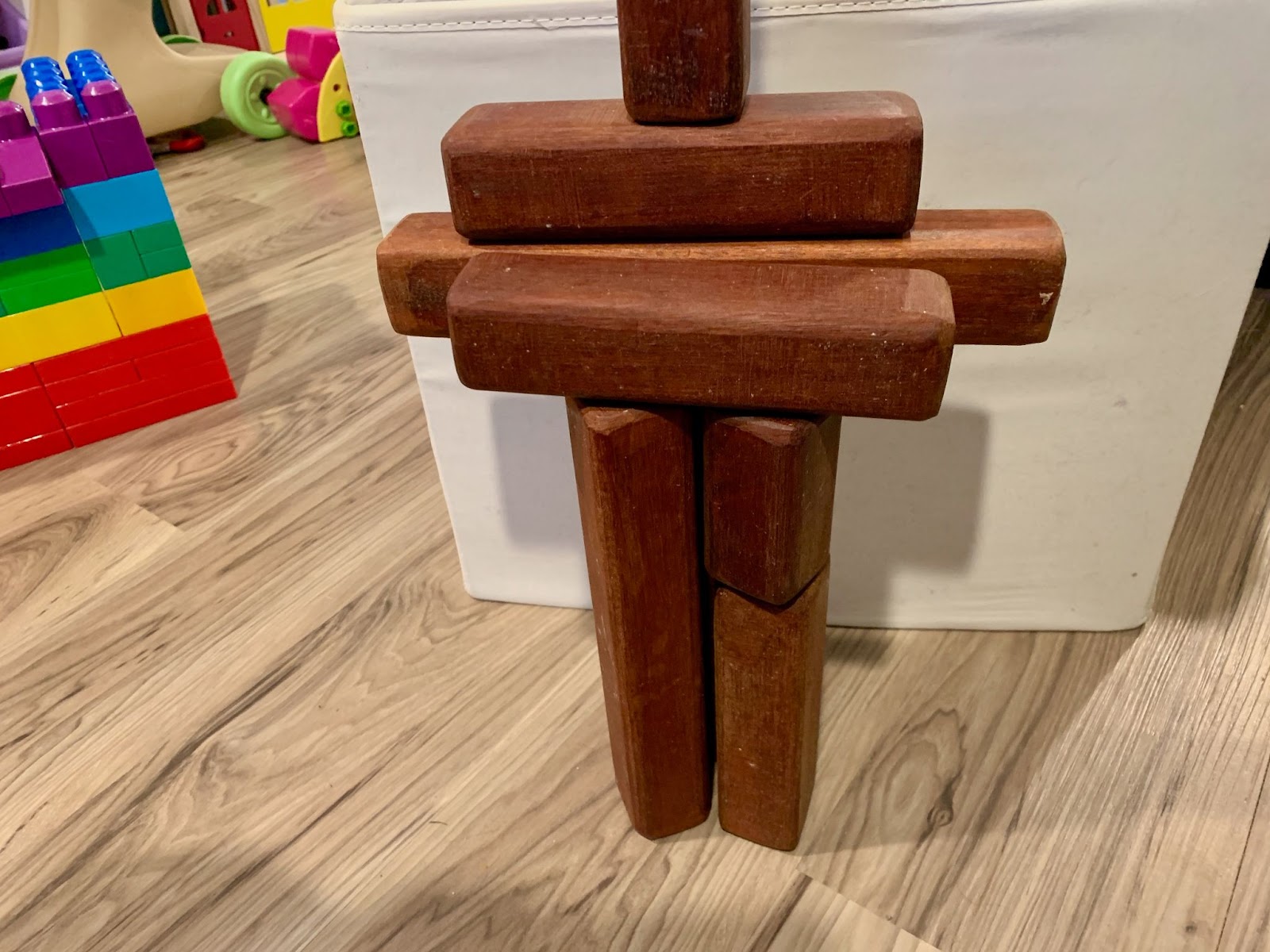 Wooden toy figure. Building with blocks. Educational toy for kids. Creative play. Childhood development.