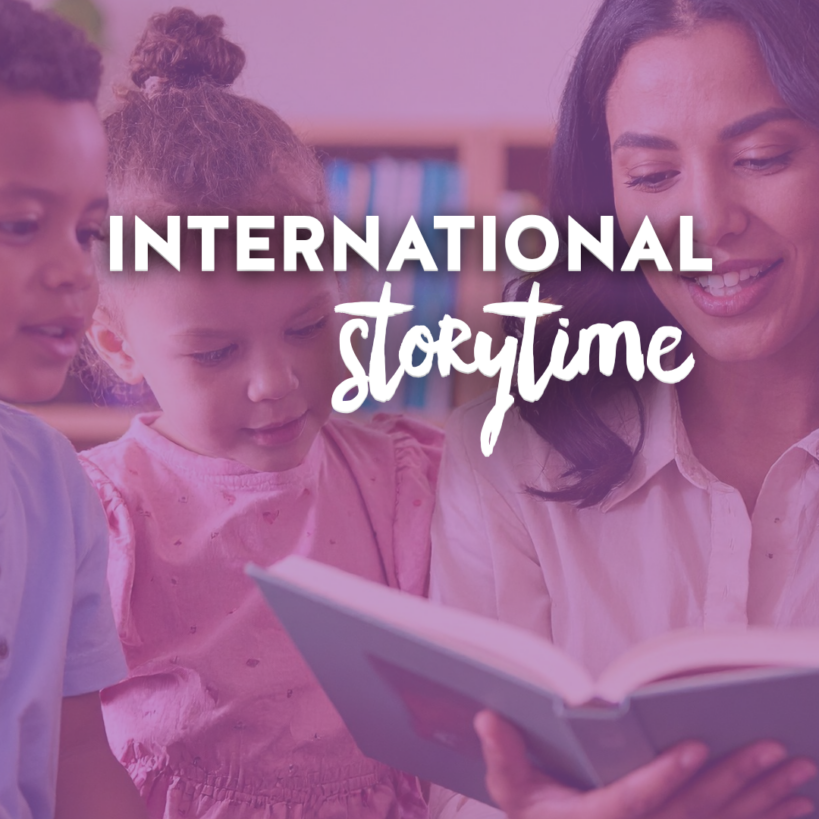 A woman reads a book to two young children with the text International Storytime overlaid in the center.