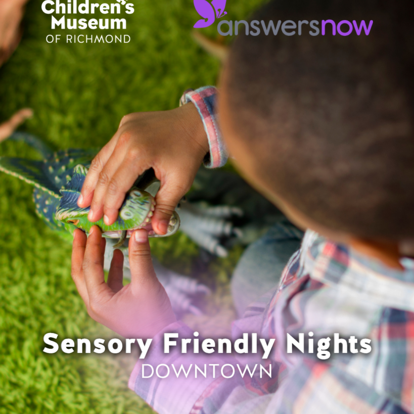 Child playing with a green dinosaur toy on a green carpet at a Sensory Friendly Nights Downtown event.